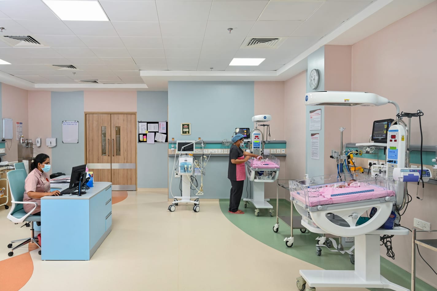 Neonatal intensive care unit with incubators and a nurses’ station