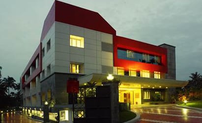 CIMAR Kochi hospital building at dusk
